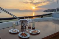 GLAROS yacht charter: Sundeck by sunset