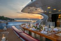 GLAROS yacht charter: Dining area by sunset