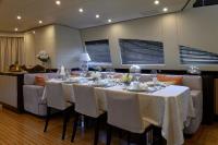 ATHOS yacht charter: salon with dinner table dressing