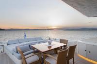 SUN-ANEMOS yacht charter: Aft deck with alfresco dining and Sunpad