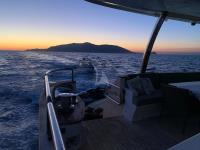 DON-MICHELE yacht charter: Further cockpit view at sunset time