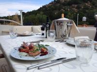 ARAMIS yacht charter: detail of dressed cockpit table