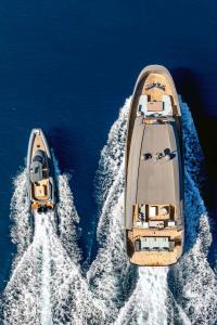 KOKONUTS-WALLY yacht charter: Running with tender