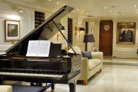 CHRISTINA-O yacht charter: Steinway next to dining table
