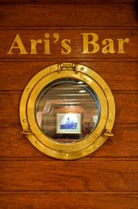 CHRISTINA-O yacht charter: Door to the Ari's bar